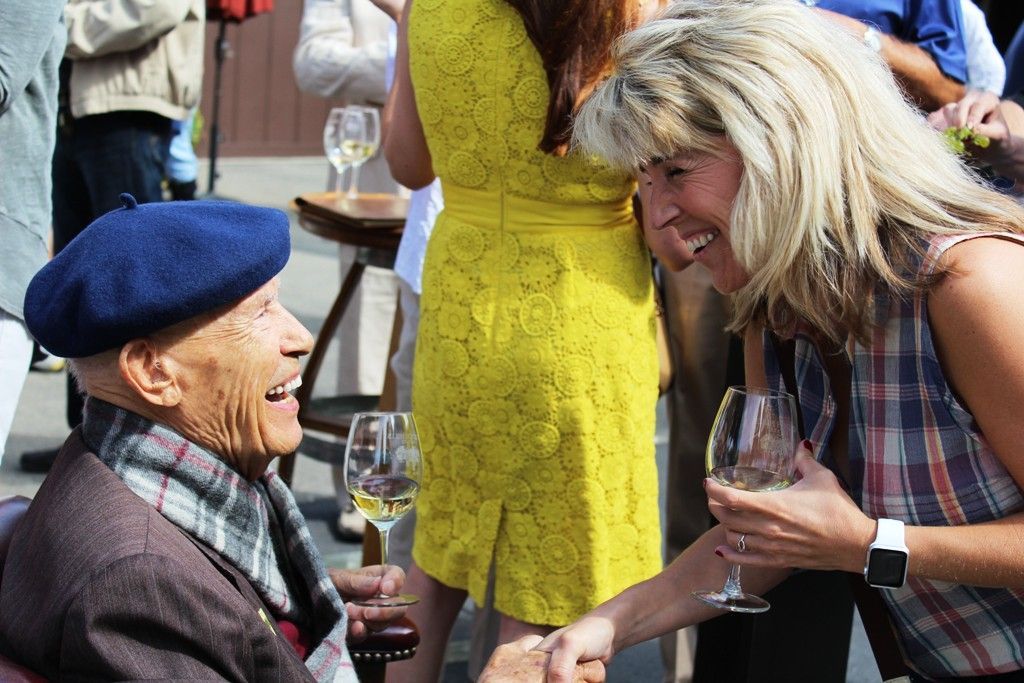 Miljenko "Mike" Grgich laughs with a guest at the Blessing of the Grapes 2015